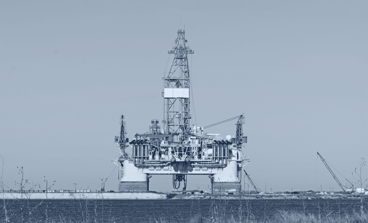 Semi-submersible drilling rig moored inshore.